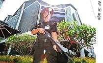 Gurkha soldier stands guard outside venue of IMF- World Bank meetings in Singapore