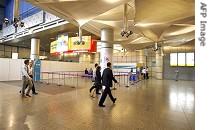 People walk past designated space for protesters at Suntec City Convention center, Wednesday