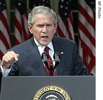 President Bush gestures as he speaks during a press conference in the Rose Garden, Friday, September 15