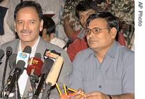 Nepalese Home Minister Krishna Prasad Sitaula, left, and Maoist rebels spokesperson Krishna Bahadur Mahara, address a joint press conference in Katmandu, October 12, 2006 