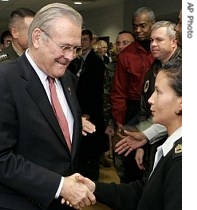 Outgoing Defense Secretary Donald H. Rumsfeld shakes hands with well wishers following town hall meeting at the Pentagon