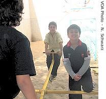 Lebanese children play outside a Dakar church, 10 Jul 2007