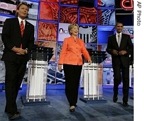 Democratic presidential hopefuls former Senator John Edwards (left), Senator Hillary Rodham Clinton (center), Senator Barack Obama (right), stand together before the start of a debate on CNN, 23 July 2007