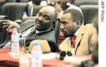 Faction leaders for SLM Khamis Abdalla Abakar, left, and SLA Ahmed Abdulshafi chat during a session of AU-UN sponsored negotiations in Tanzania, 06 Aug 2007