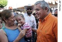 Otto Perez Molina greets supporters during a campaign rally in La Democracia, south of Guatemala City, 06 Sept 2007