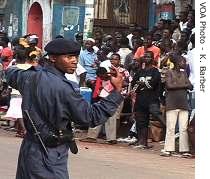 Police keep crowds back from the polling stations after the vote is over