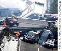 Vehicles are scattered along the broken remains of the Interstate 35W bridge, 01 Aug 2007 