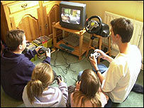 Teenagers playing a computer game 