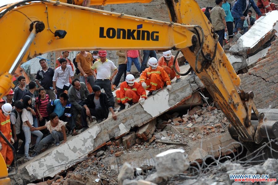 Rescuers search for survivors in the ruins after a 6.5-magnitude earthquake in Longtoushan Town under Ludian County of Zhaotong, southwest China