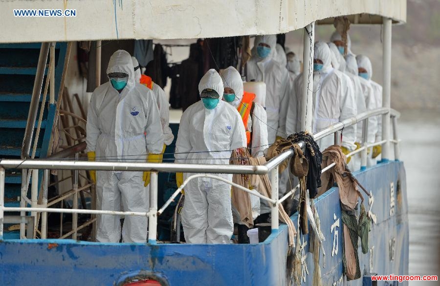 A mourning ceremony is held for 406 deceased people on the capsized ship Eastern Star at the sinking site in the Jianli section of the Yangtze River, central China