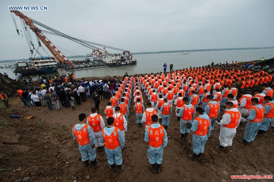 A mourning ceremony is held for 406 deceased people on the capsized ship Eastern Star at the sinking site in the Jianli section of the Yangtze River, central China