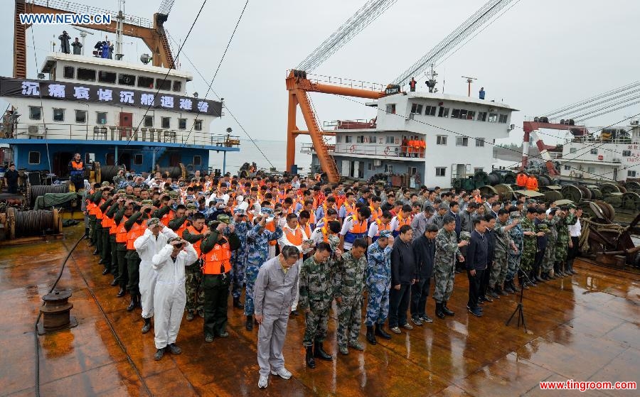 A mourning ceremony is held for 406 deceased people on the capsized ship Eastern Star at the sinking site in the Jianli section of the Yangtze River, central China