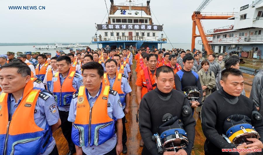 A mourning ceremony is held for 406 deceased people on the capsized ship Eastern Star at the sinking site in the Jianli section of the Yangtze River, central China