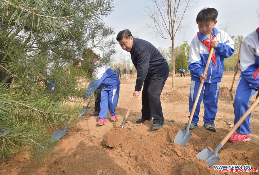  Chinese President Xi Jinping (C) plants a sapling with students during a tree-planting event in Xihongmen Township of Daxing District in Beijing, capital of China, April 5, 2016. Top leaders Xi Jinping, Li Keqiang, Zhang Dejiang, Yu Zhengsheng, Liu Yunshan, Wang Qishan and Zhang Gaoli attended a voluntary tree-planting in Beijing on Tuesday. (Xinhua/Li Tao) 