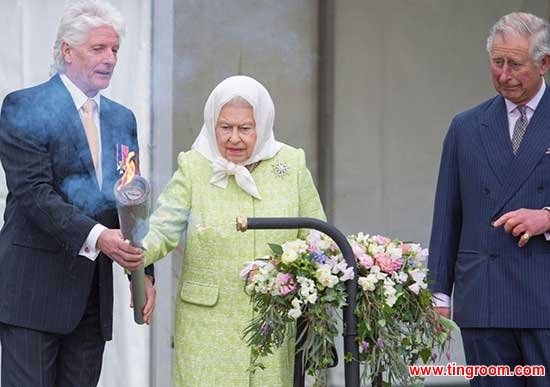 Pageantmaster Bruno Peek (L) hands Britain