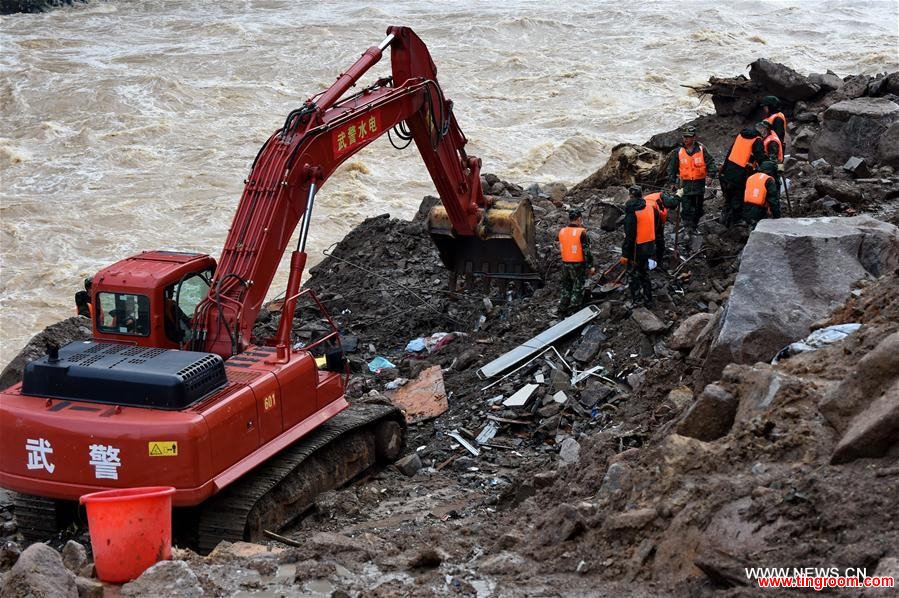 TAINING, May 9, 2016 (Xinhua) -- Rescuers search at the landslide site in Taining County, southeast China