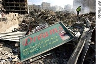 Lebanese Civil Defense worker searches for bodies in rubble of apartment building bombed by Israeli army in southern Beirut suburb 