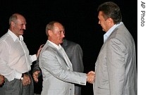 Russian President Vladimir Putin and Ukraine's Prime Minister Viktor Yanukovych, right, shake hands as Belarusian President Alexander Lukashenko, left, looks on during a meeting in southern Russia on Tuesday 