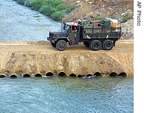 Lebanese troops cross the Litani River at the Khardali bridge, in the southern town of Marjayoun, Lebanon, Thursday, August 17, 2006