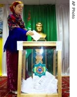 Voter casts her ballot at a polling station in Ashgabad, Turkmenistan, 11 Feb 2007