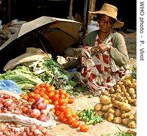 Food seller at a market in Alem Kitmama, Ethiopia