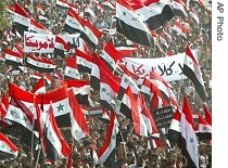 Followers of radical anti-U.S. cleric Muqtada al-Sadr march through the holy city of Najaf, 09 Apr 2007