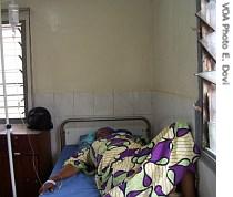 This patient is receiving IV fluid to help treat a Malaria infection at Iran Clinic in Accra