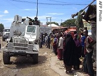 Africa Union (AU) troops patrol a street in Mogadishu, 01 May 2007 