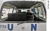 A Palestinian checks the damage in a U.N vehicle next to a U.N.-operated elementary school after an attack by Palestinian militants at Rafah refugee camp, southern Gaza Strip, 06 Sun 2007