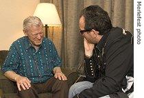 Doc Watson talks with Elvis Costello at 2007 Merlefest