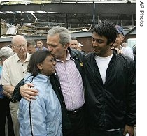 U.S. President Bush (l) comforts residents, as he tours tornado damage in Greensburg, Kansas, 09 May 2007