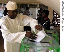 A voter casts his ballot at a polling station in Abuja, Nigeria