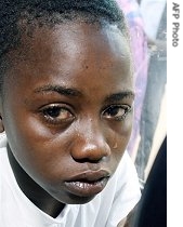 A boy, victim of a child traffic, cries in a mini van taking him back to his country, 22 Feb 2007, in Aboisso, Ivory Coast