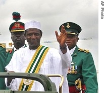 Umaru Yar'Adua, 56, waves to  supporters after he is sworn in in Abuja, 29 May 2007