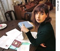 Russiam immigrant Sveta Nikitina has to deal with poses with her immigration papers at her home in Mill Valley, Calif. (February 2007 photo) 