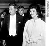 The president and first lady arrive at an inaugural ball