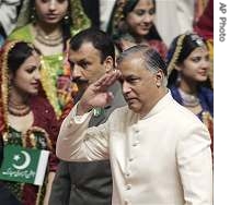 Pakistan's PM Shaukat Aziz salutes as he arrives to hoist a national flag to mark the 60th anniversary of independence from British rule, in Islamabad, 14 Aug 2007