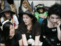 Harry Potter fans dressed as wizards lining up to buy the book